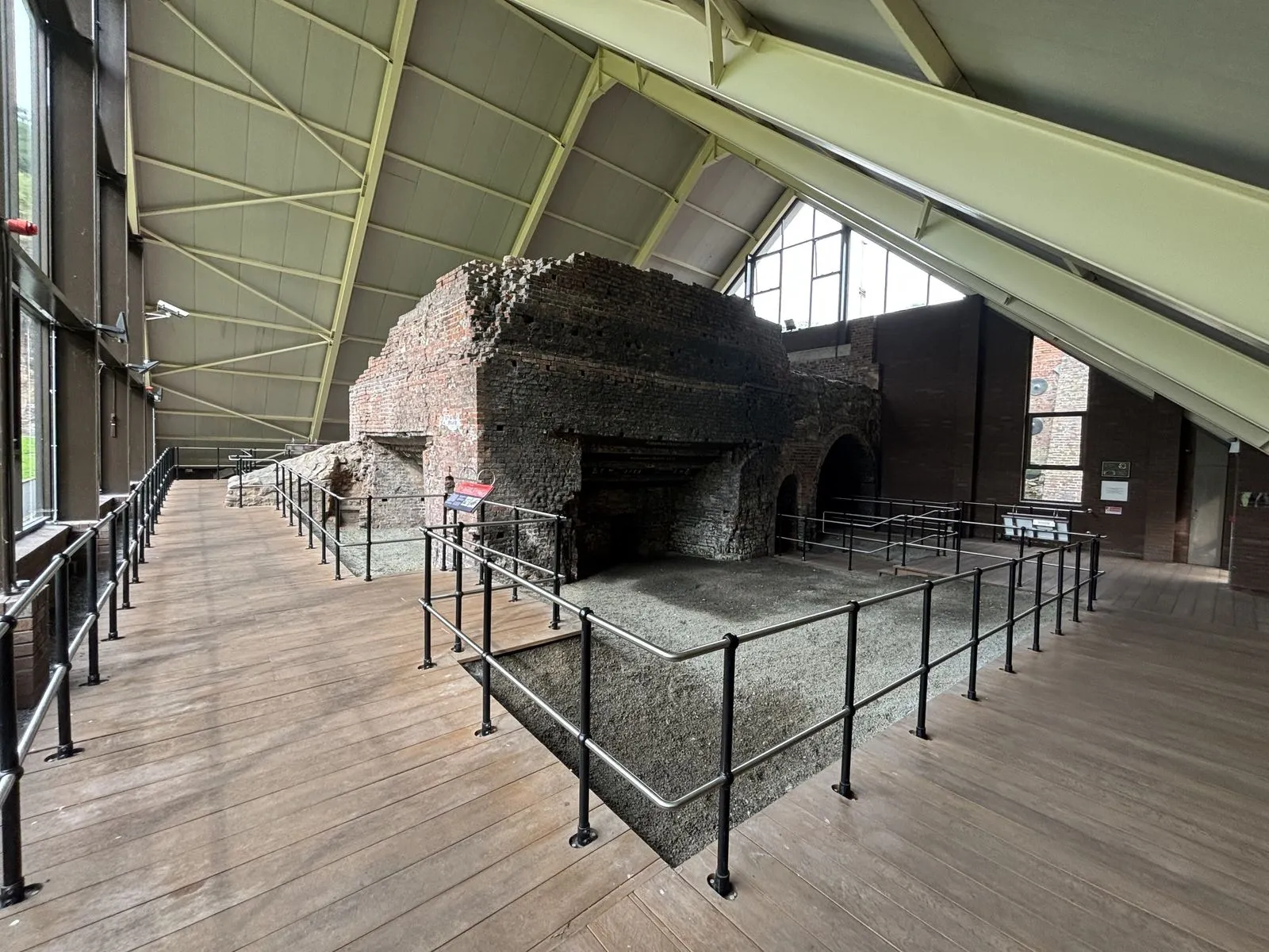 The Darbys' Old Furnace at Coalbrookdale, preserved inside a modern steel-and-glass cover building